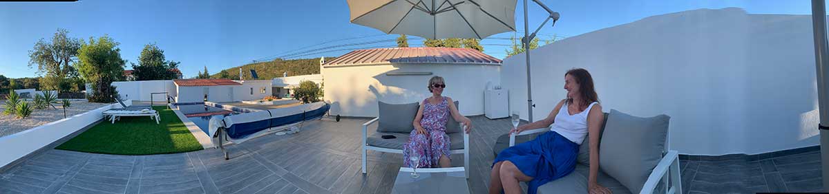 Panorama of the Villa Lola Garden including swimming pool, Sun Terrace and Grass area.